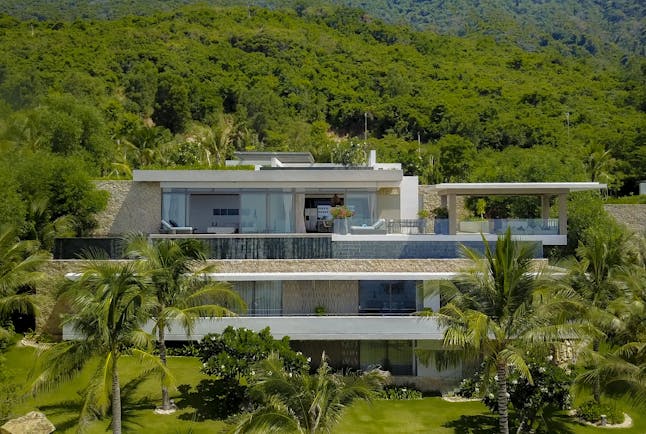 Mia Nha Trang Resort five bedroom villa exterior, contemporary architecture, balconies, tropical forest in background