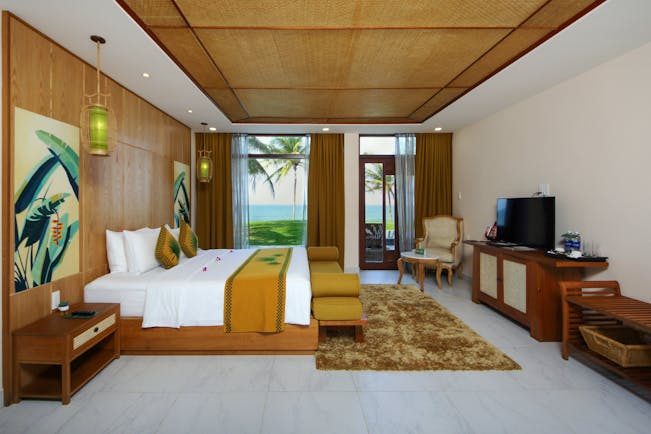 Palm Garden Resort deluxe room, double bed, television, bright modern decor