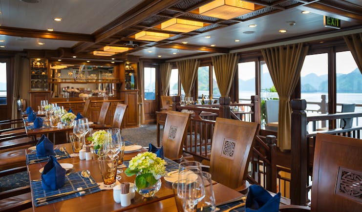 Paradise Peak Cruise restaurant on board, traditional decor, windows with views out to sea