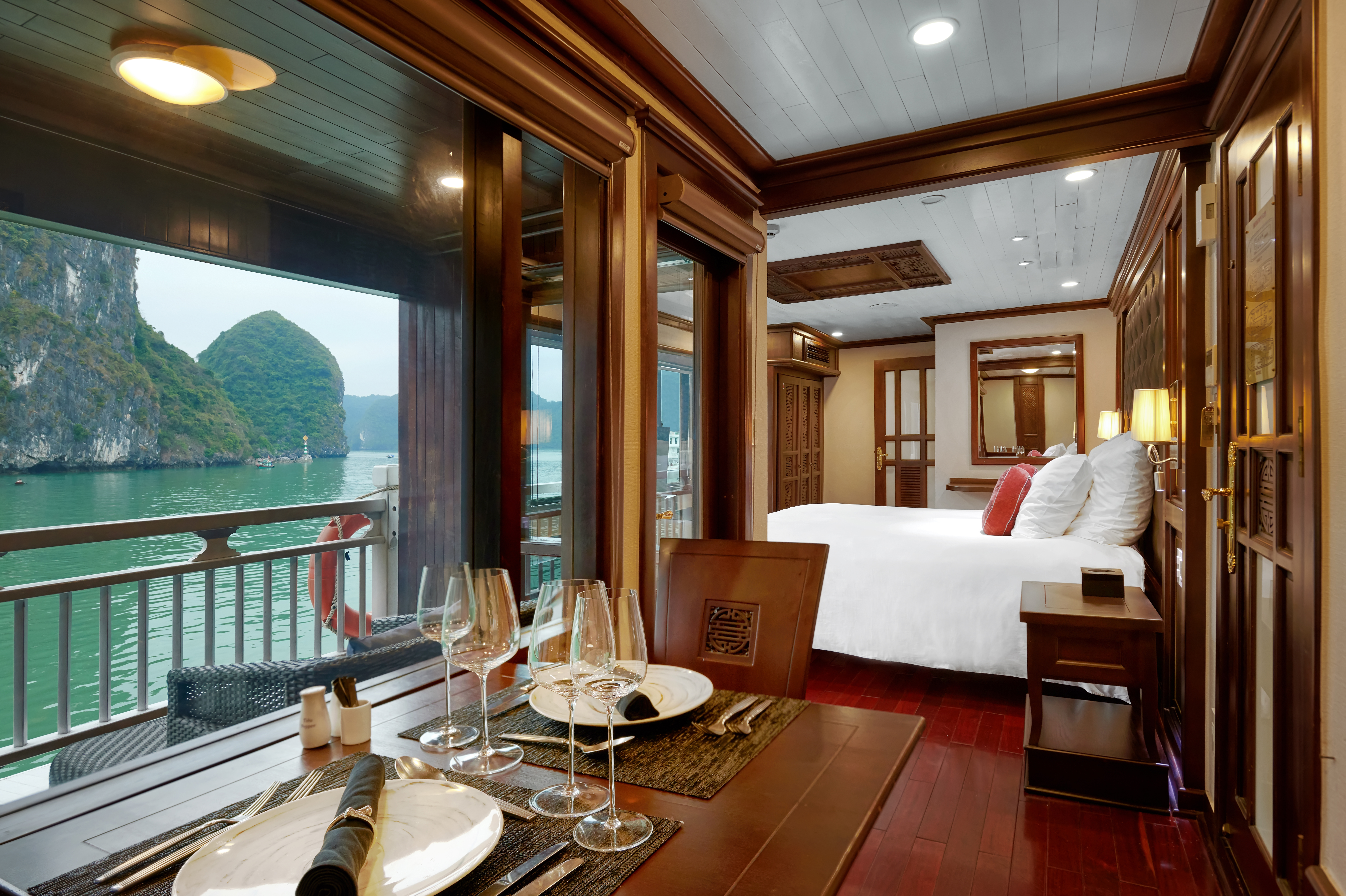 Paradise Peak Cruise superior suite, double bed, living area, largw windows with views over the sea