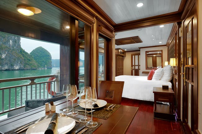 Paradise Peak Cruise superior suite, double bed, living area, largw windows with views over the sea