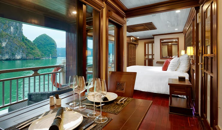 Paradise Peak Cruise superior suite, double bed, living area, largw windows with views over the sea
