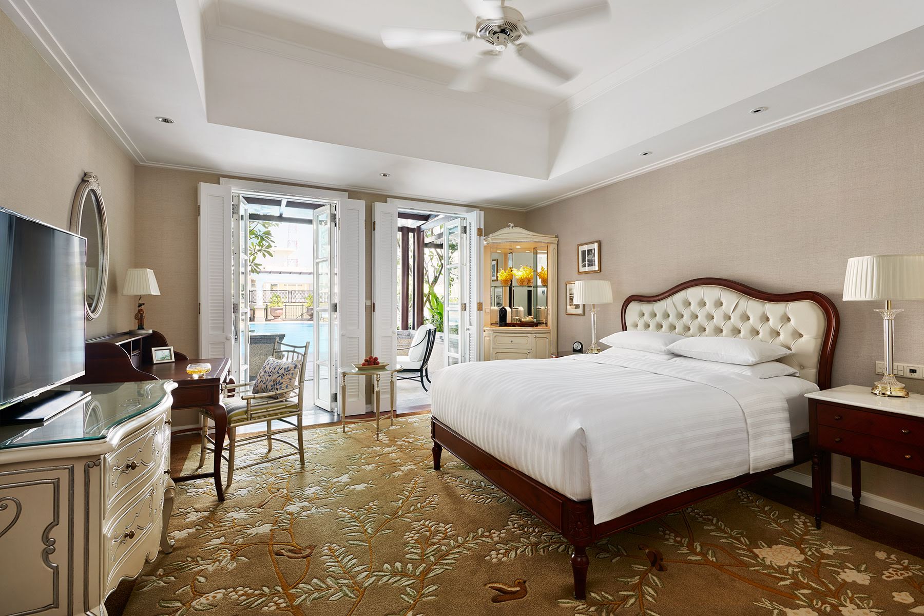 Park Hyatt Saigon deluxe room, double bed, desk, french windows leading to balcony, elegant decor