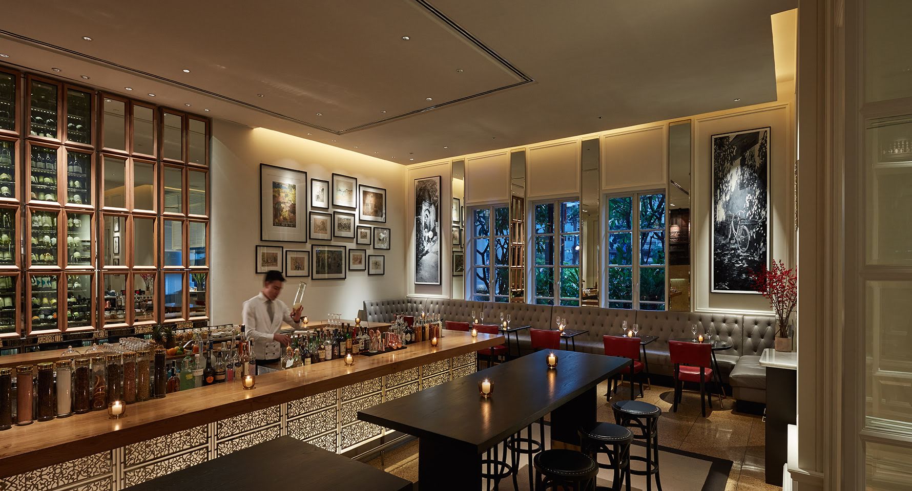 Park Hyatt Saigon opera bar, elegant modern decor, bartender mixing drinks, 