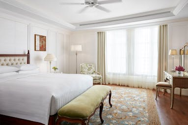 Park Hyatt Saigon presidential suite bedroom, double bed, vanity table, bright elegant decor