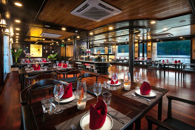 Perla Dawn Sails Cruise restaurant on board boat, wooden floors and ceiling, wide windows with views over sea