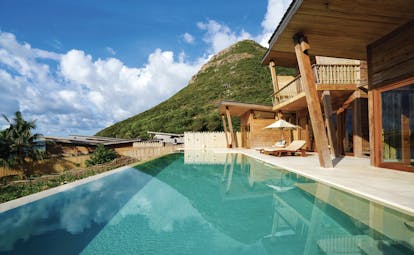 Six Senses Vietnam ocean view villa terrace sun loungers infinity pool