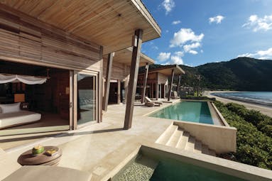 Six Senses Vietnam pool villa exterior pool terrace sun loungers beach views