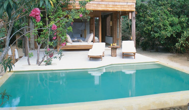 Six Senses Ninh Van Bay Vietnam private pool villa exterior loungers trees and gardens