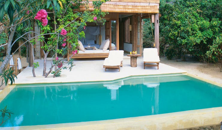 Six Senses Ninh Van Bay Vietnam private pool villa exterior loungers trees and gardens