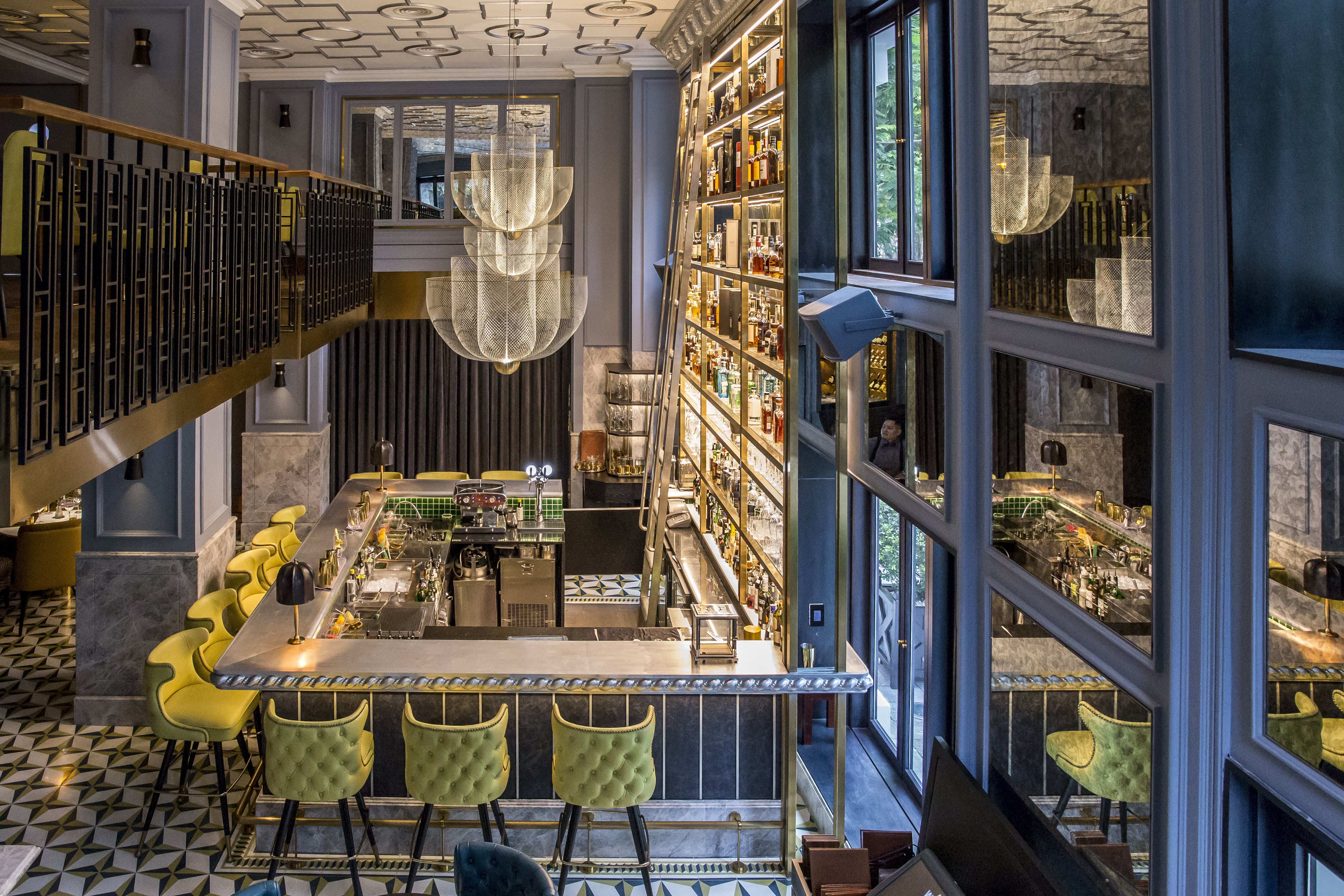 Sofitel Metropole Hanoi bar, modern elegant decor, chandeliers, bar stools