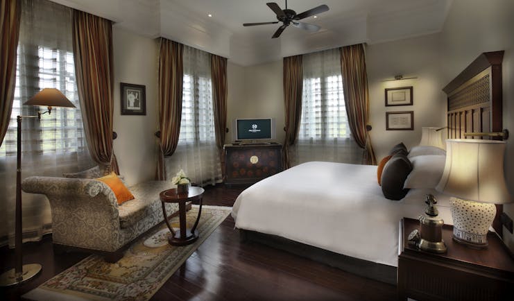 Sofitel Metropole Hanoi legendary suite, double bed, sofa, grand decor