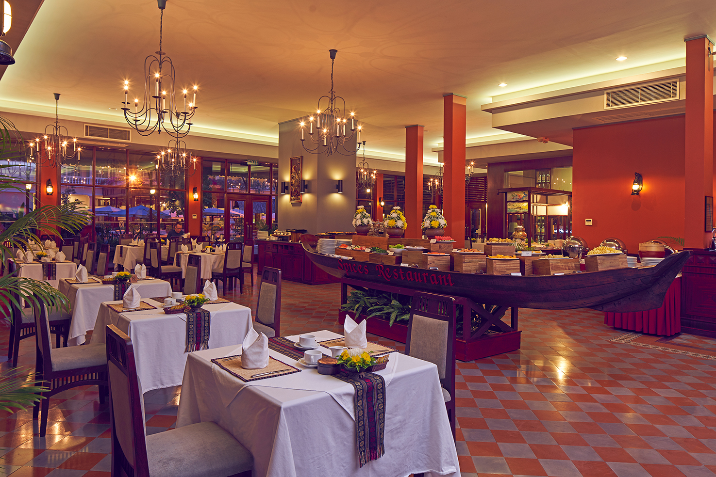 Victoria Can Tho Resort restaurant, traditional decor, tables and chairs, chandeliers