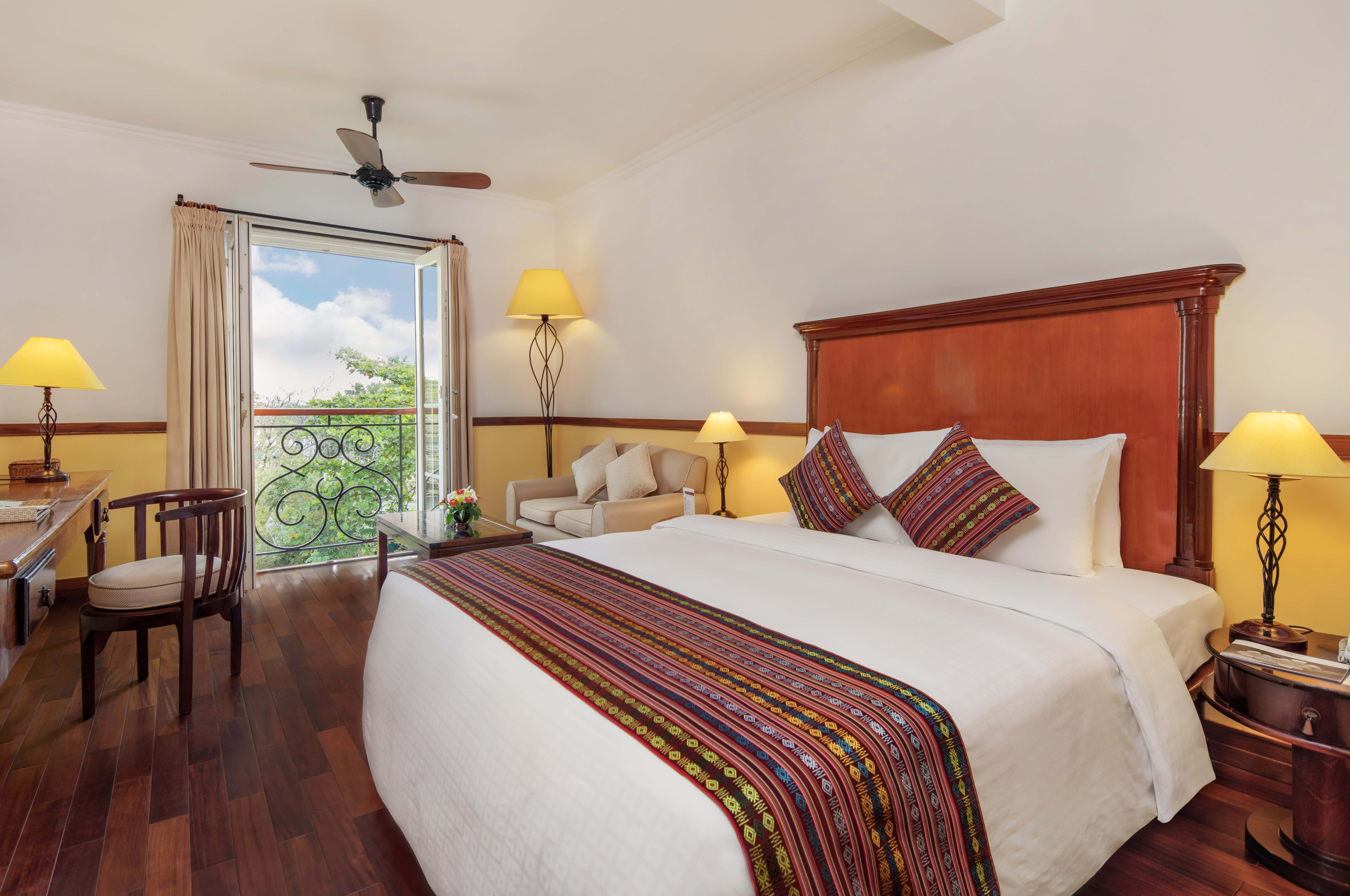 Victoria Can Tho Resort superior guestroom, double bed, bright modern decor, juliet balcony