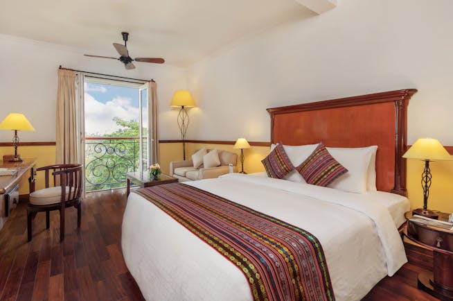 Victoria Can Tho Resort superior guestroom, double bed, bright modern decor, juliet balcony