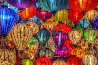 Lanterns for sale in Vietnam, multicoloured and intricate designs, traditional paper lanterns