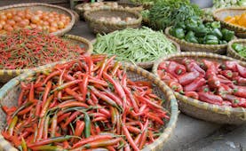 Vegetables for sale at a market in Hanoi, chillies, peppers, green beans tomatoes, onions