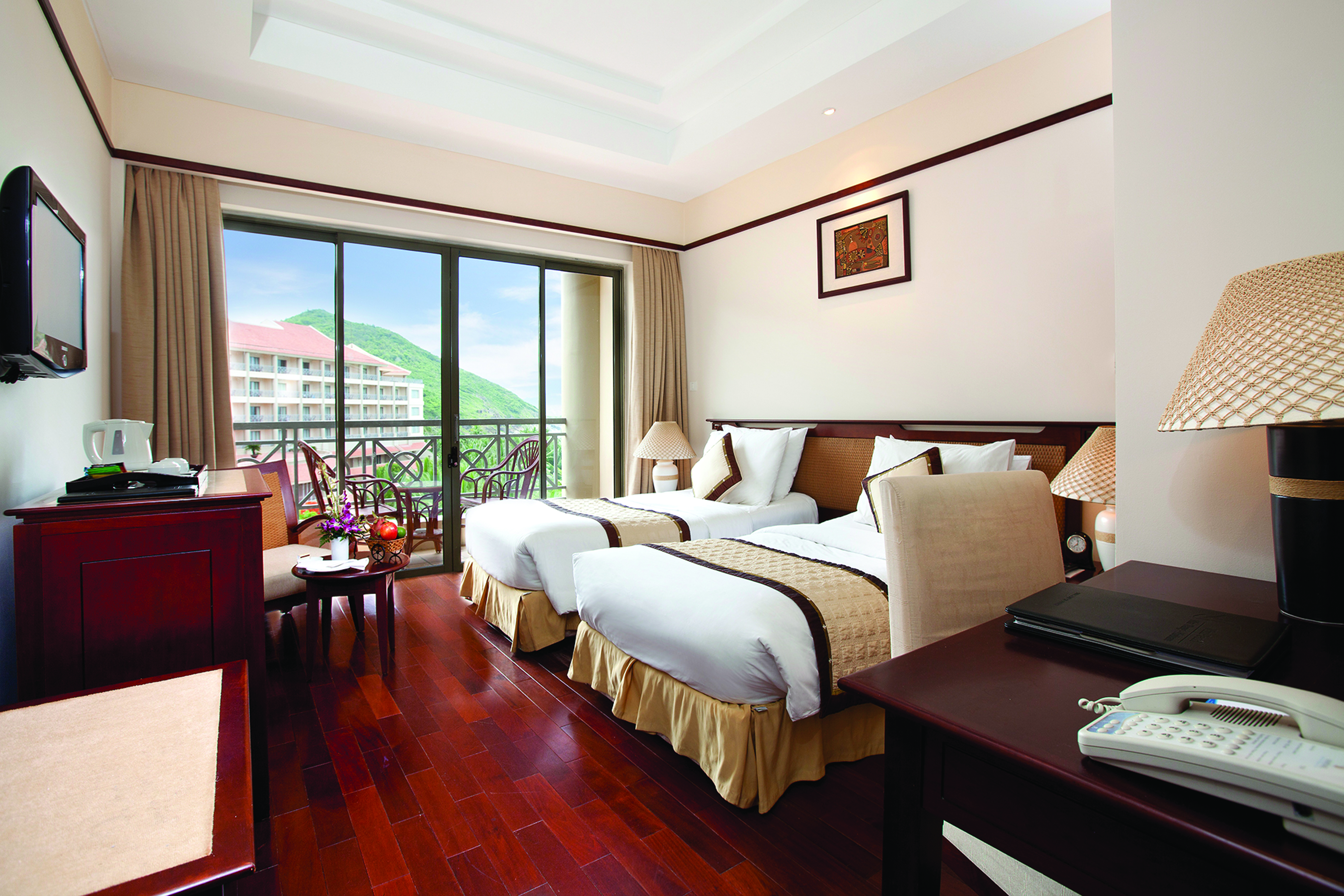 Vinpearl Luxury Nha Trang Vietnam deluxe guestroom twin beds modern décor