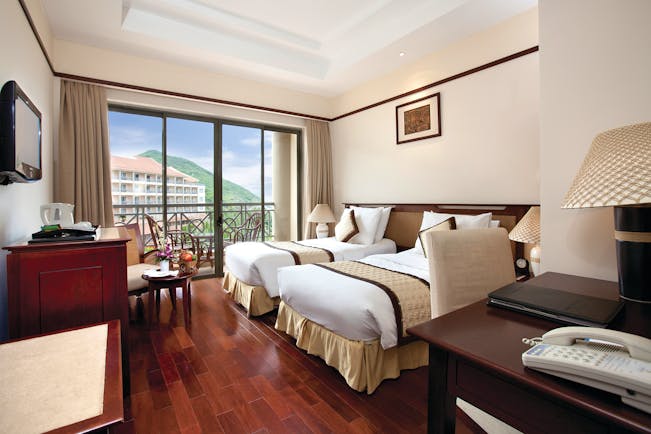 Vinpearl Luxury Nha Trang Vietnam deluxe guestroom twin beds modern décor