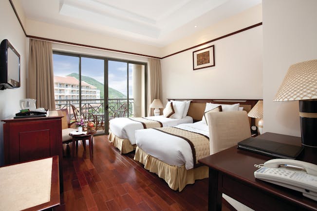 Vinpearl Luxury Nha Trang Vietnam deluxe guestroom twin beds modern décor