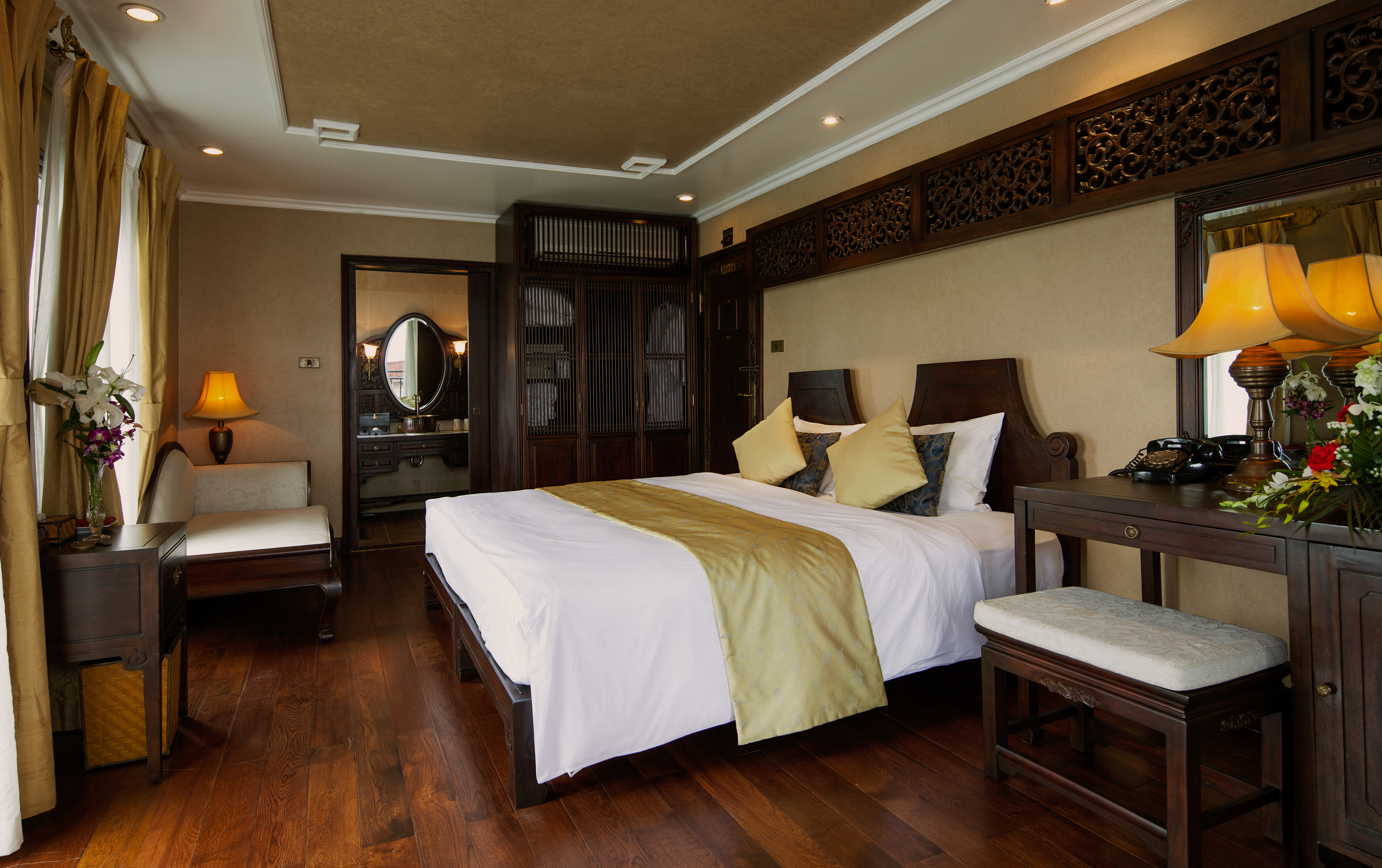 Violet Cruise imperial suite, double bed, armchair, wardrobe, tradtional decor, wooden details