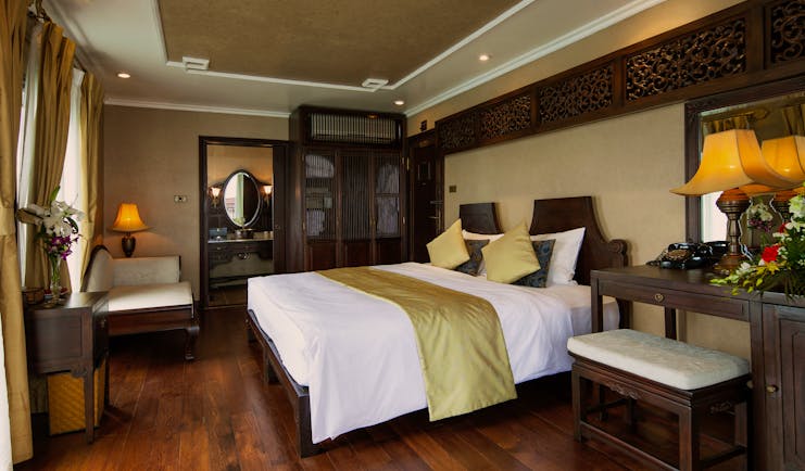 Violet Cruise imperial suite, double bed, armchair, wardrobe, tradtional decor, wooden details