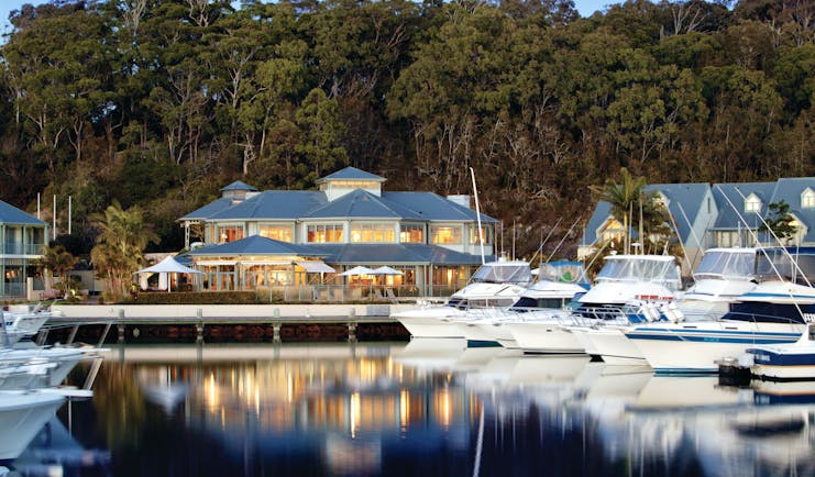 Anchorage Port Stephens New South Wales and Sydney exterior white building near a marina with boats