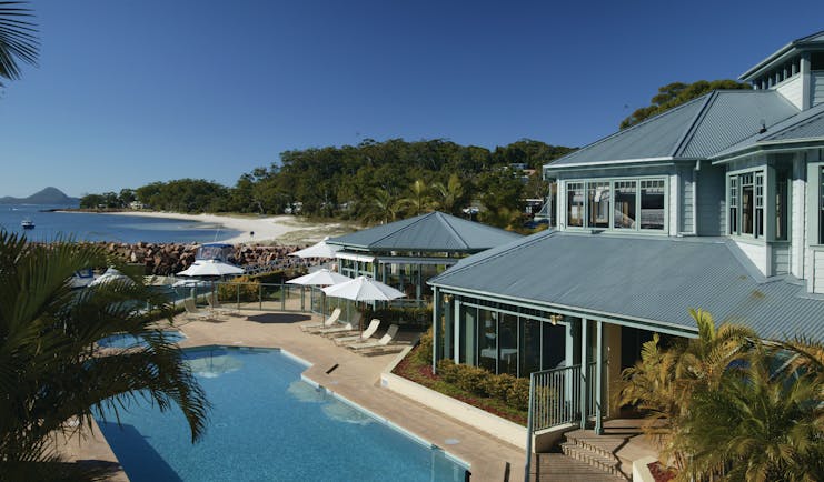 Anchorage Port Stephens New South Wales and Sydney pool with palm trees and sea view