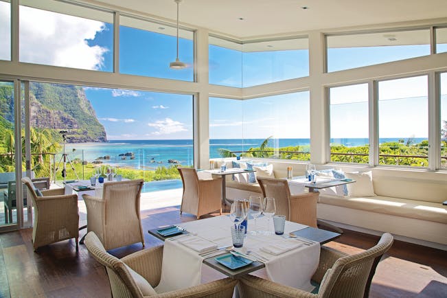 Capella Lodge restaurant, elegant and modern interiors, views overlooking bay and mountains