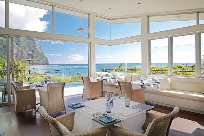 Capella Lodge restaurant, elegant and modern interiors, views overlooking bay and mountains