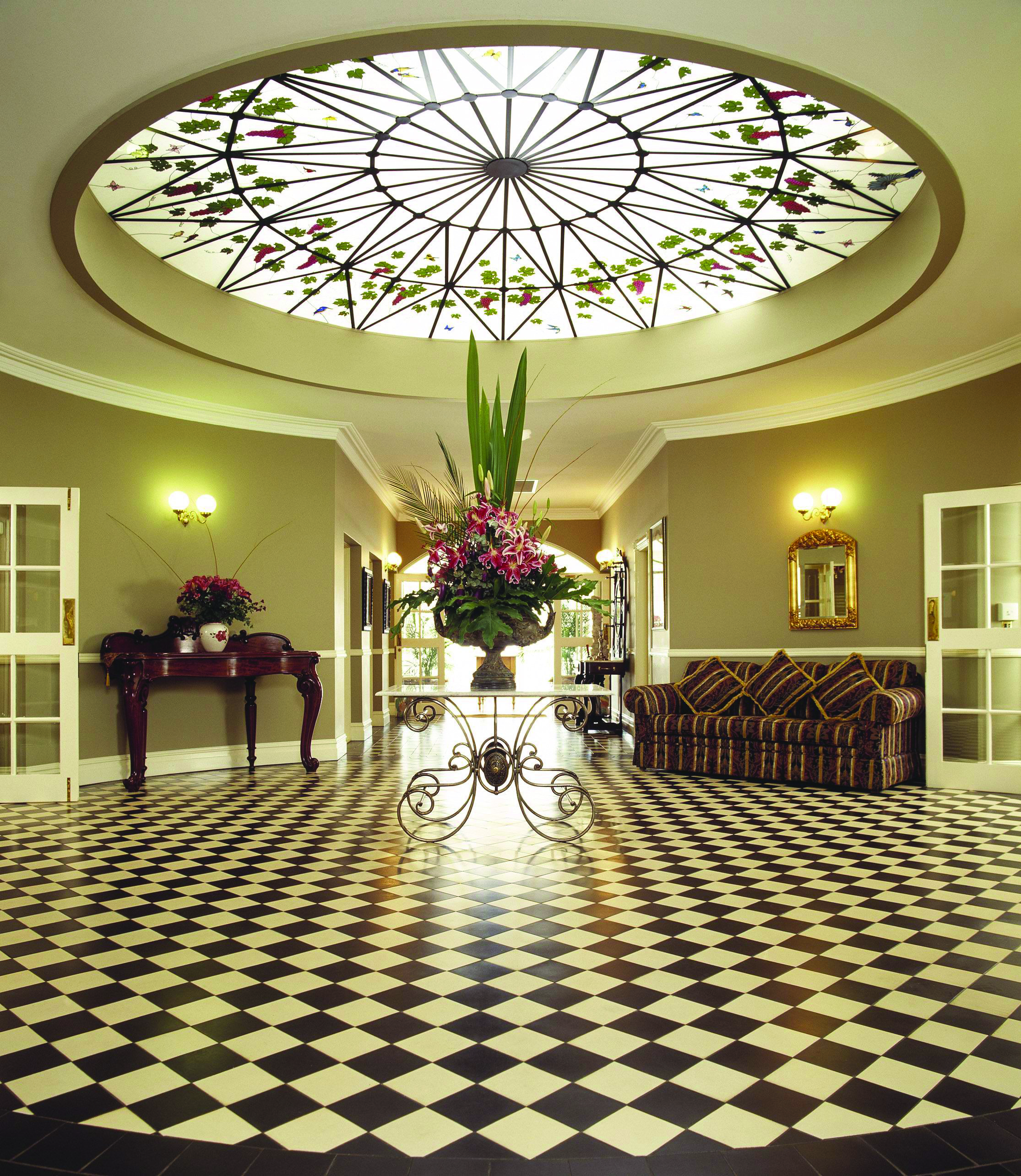 Sebel Kirkton Park New South Wales lobby area with sofa table with flowers and glass ceiling
