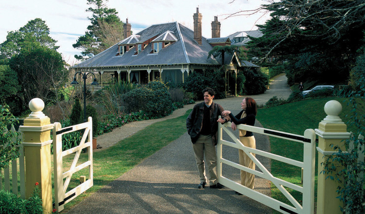 Lilianfels New South Wales exterior gate couple at a gate in front of a building with grey roof