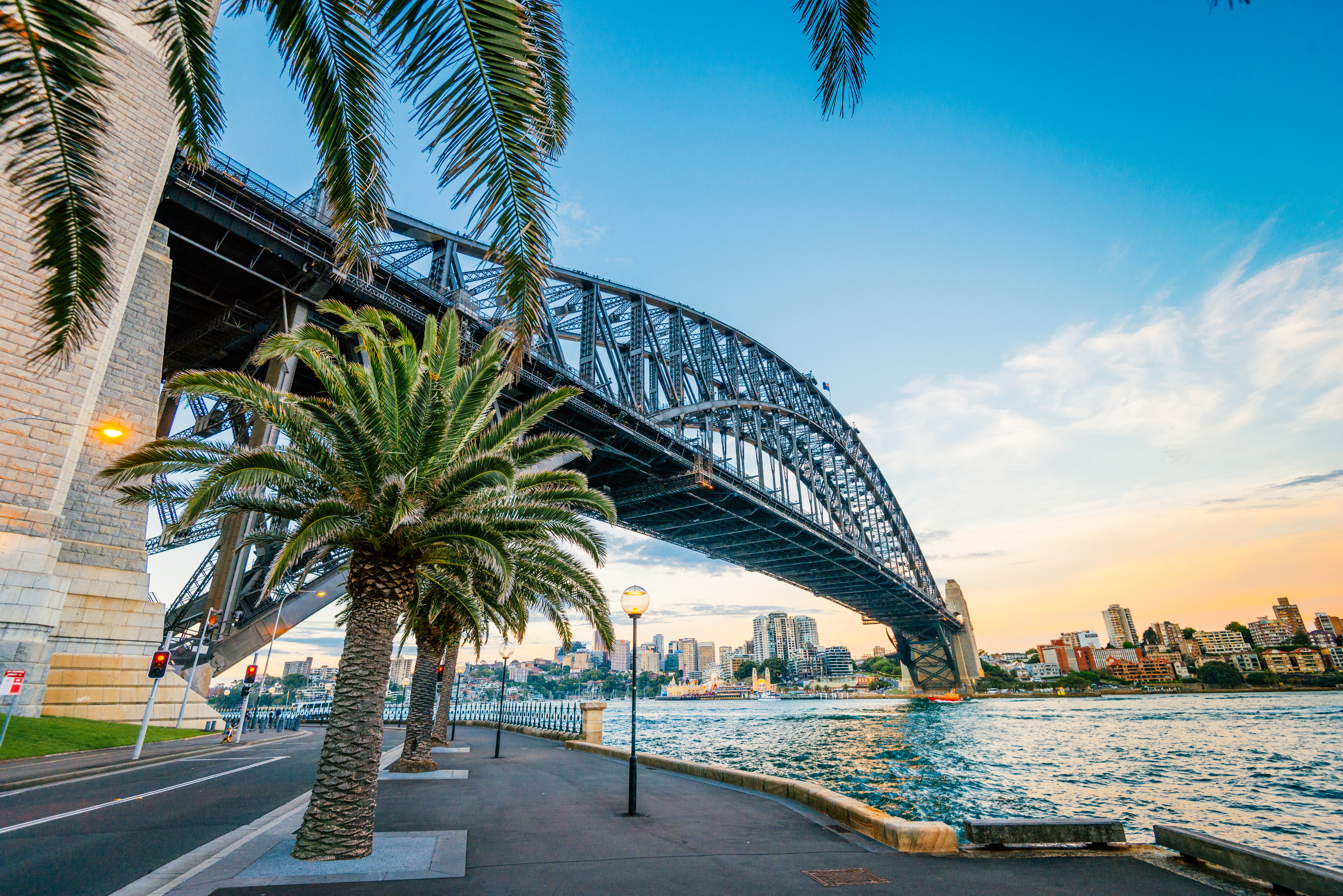 Sydney Harbour Bridge over the harbour, cityscape in background