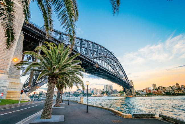 Sydney Harbour Bridge over the harbour, cityscape in background