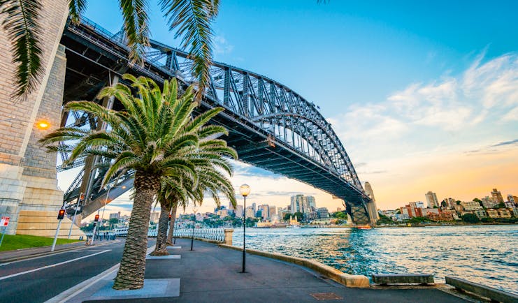 Sydney Harbour Bridge over the harbour, cityscape in background