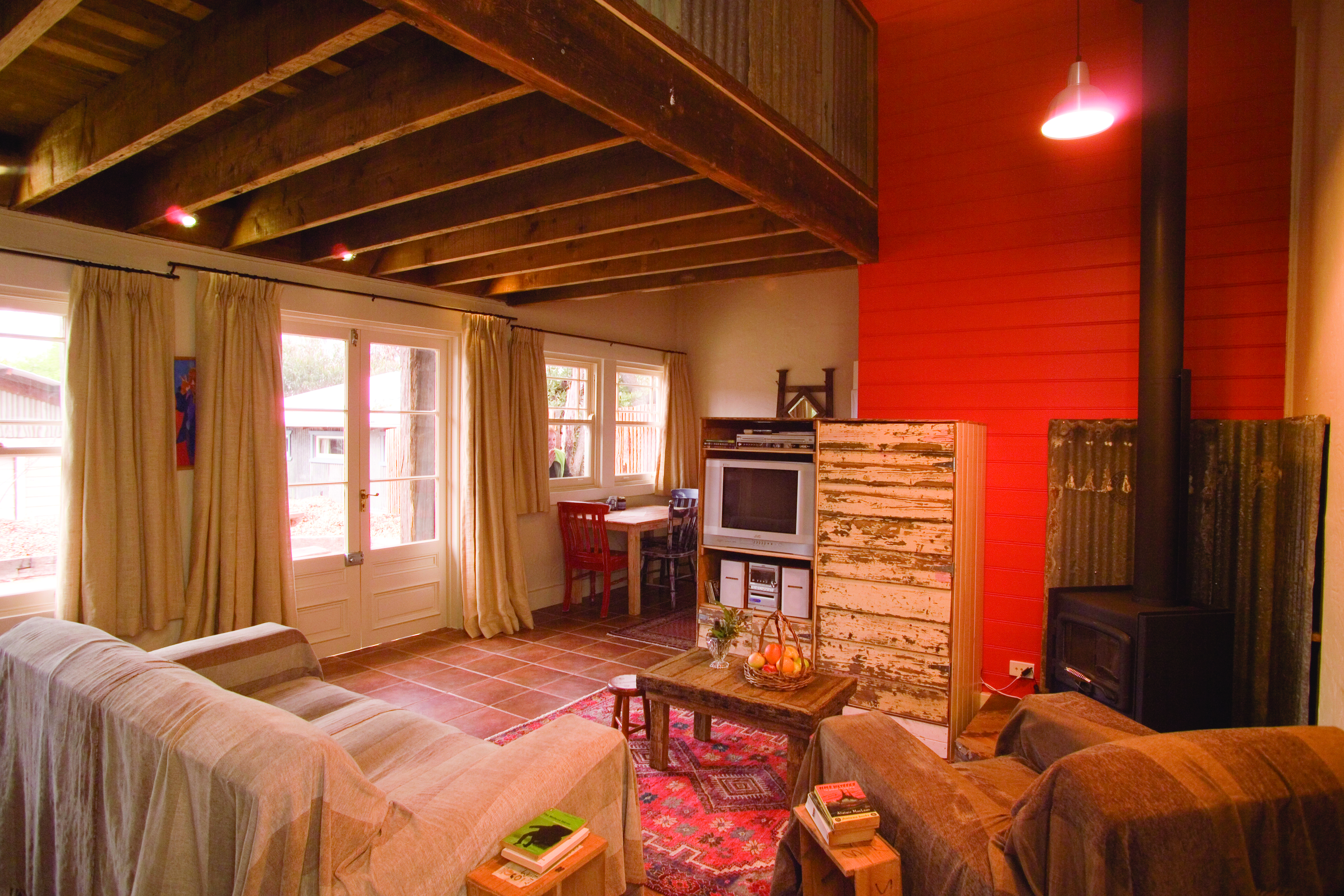 Old Leura Dairy New South Wales buttercup lounge with log fire and sofas rustic decor