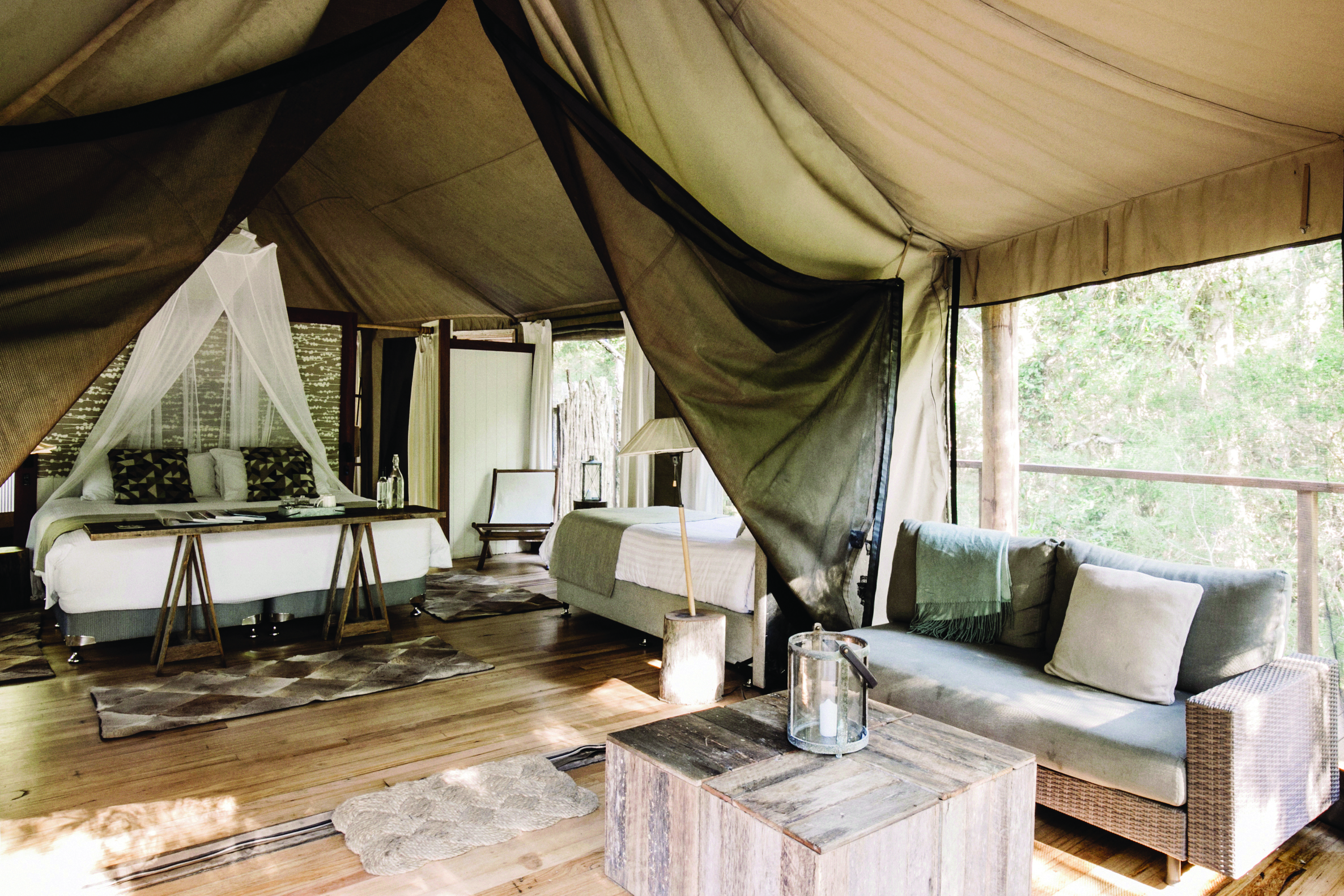Paperbark Camp New South Wales king lounge tent with bed and sitting area with sofa 