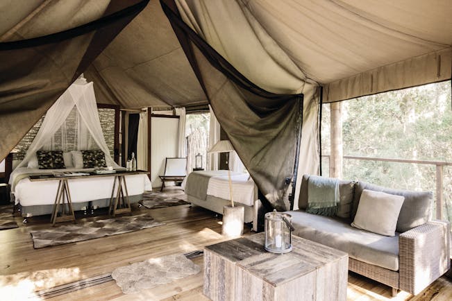 Paperbark Camp New South Wales king lounge tent with bed and sitting area with sofa 