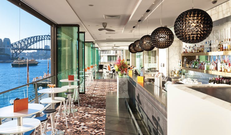 Pullman Grand Quay Sydney bar daytime with view of harbour bridge