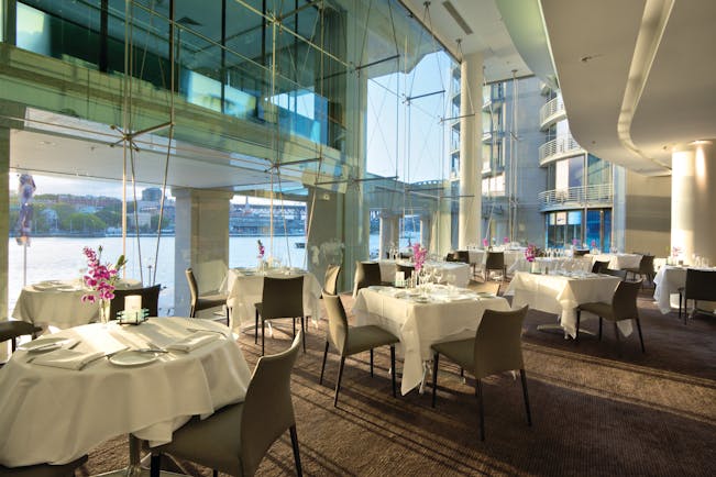 Pullman Grand Quay Sydney restaurant with floor to ceiling windows and harbour view