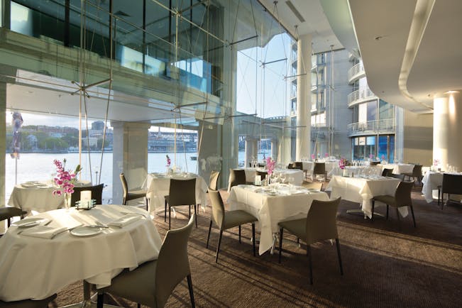 Pullman Grand Quay Sydney restaurant with floor to ceiling windows and harbour view