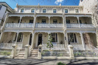 Spicers Potts Point exterior, a large cream building with arching windows and white balcony railings