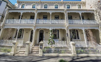 Spicers Potts Point exterior, a large cream building with arching windows and white balcony railings