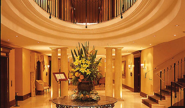 The Langham Sydney lobby area with columns and staircase