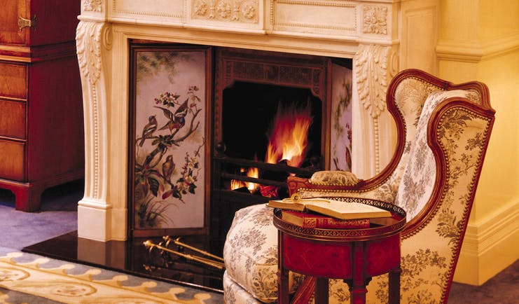 The Langham Sydney lounge ornate fireplace and antique chair