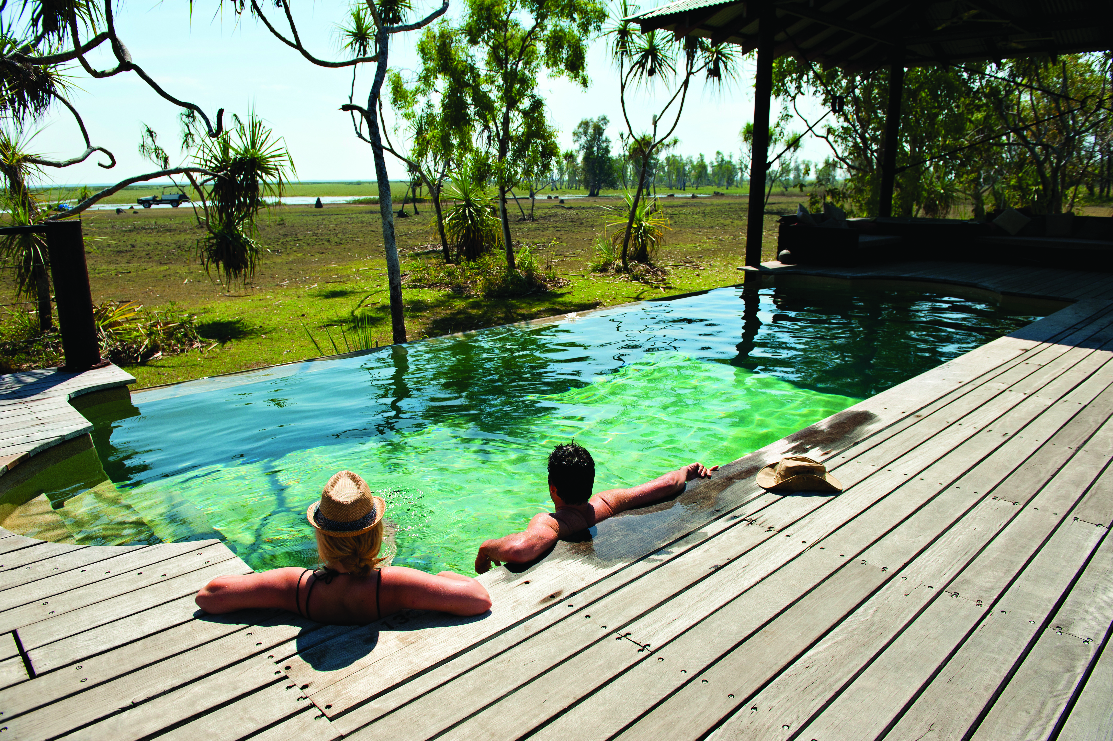 Bamurru Plains lodge exterior, netted walls, bed, set in secluded location