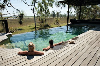 Bamurru plains lodge exterior, wooden deck, private pool overlooking outback