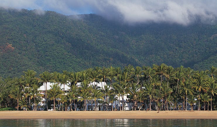 Alamanda Palm Cove Queensland exterior beach with rainforest and white building surrounded by trees