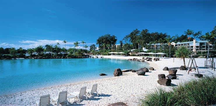 Intercontinental Sanctuary Cove lagoon with blue waters and white sand