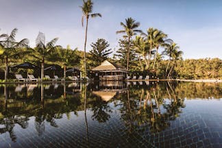 Orpheus Island pool, sun loungers, poolside bar, palm trees